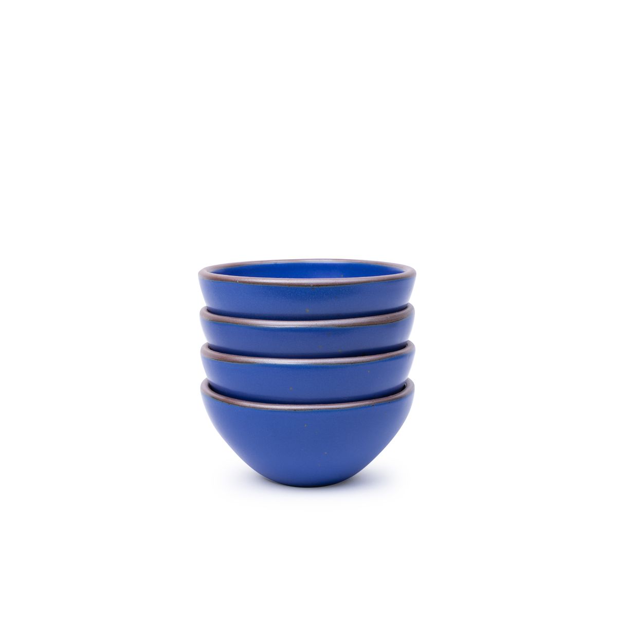 A stack of 4 small dessert sized rounded ceramic bowls in a cobalt blue color featuring iron speckles and an unglazed rim