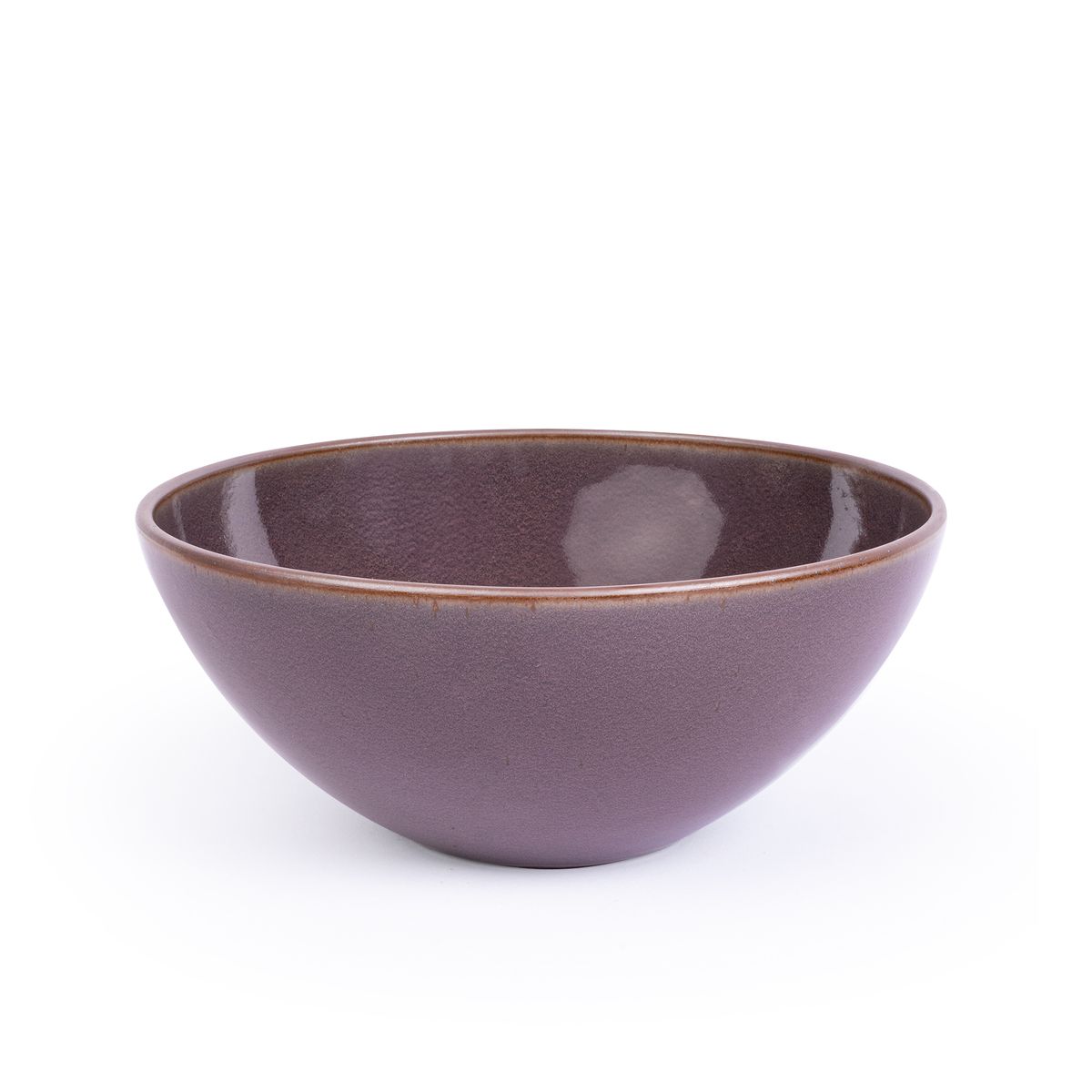A large ceramic mixing bowl in a purple color with a soft glowing sheen and an unglazed rim