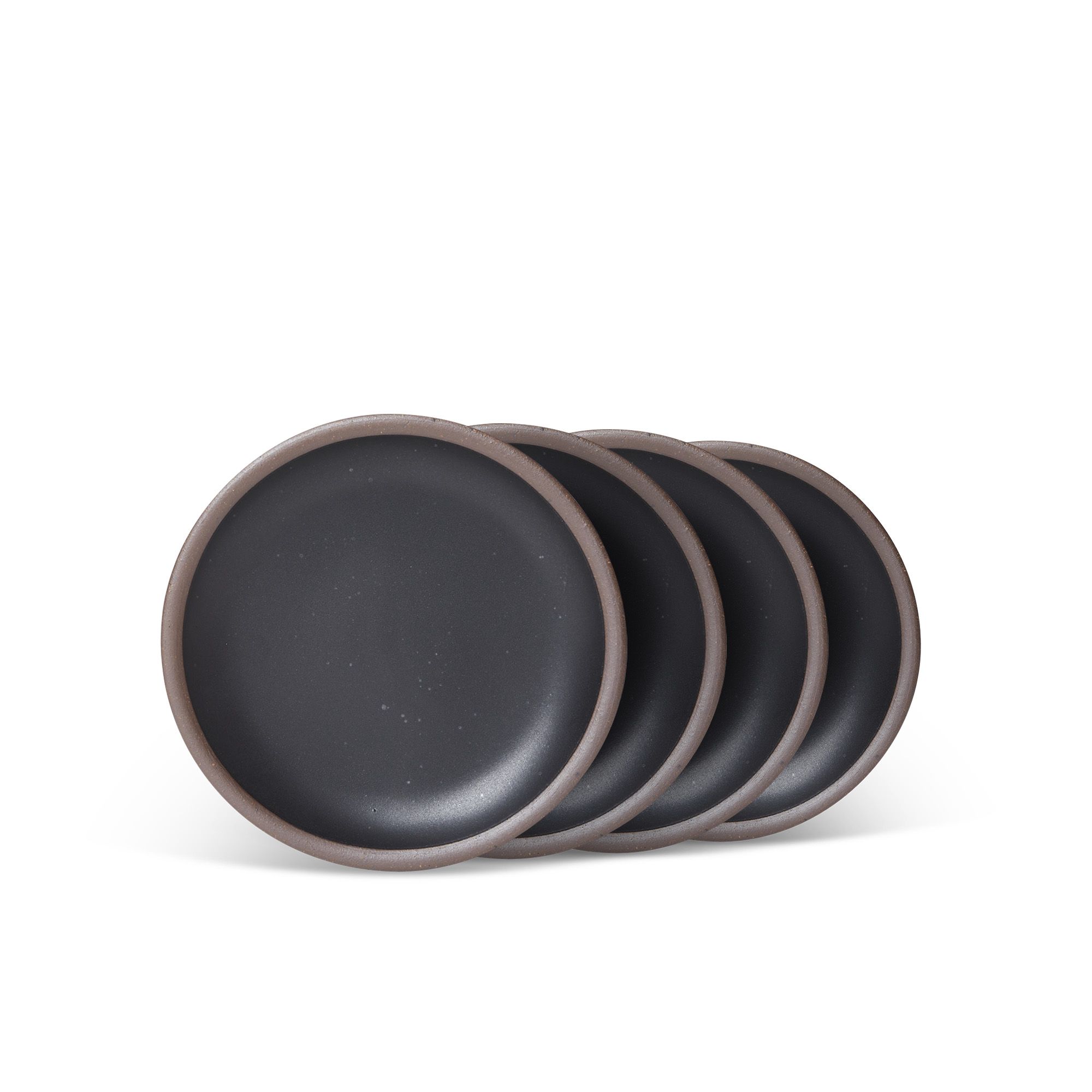 4 dessert sized ceramic plates in a graphite black color featuring iron speckles and an unglazed rim.