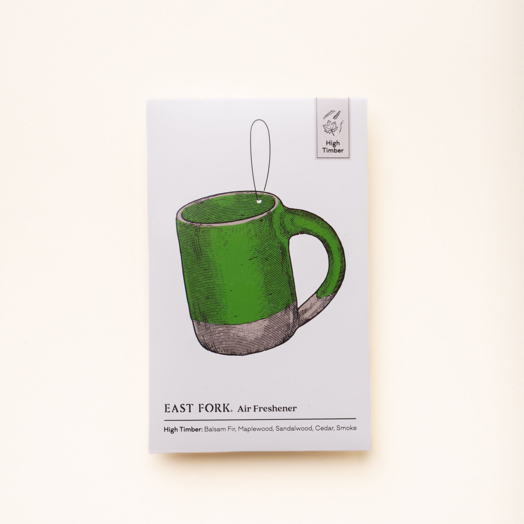 East Fork “High Timber” air freshener packaging featuring an illustrated green mug and scent notes of balsam fir, maplewood, sandalwood, cedar, and smoke.