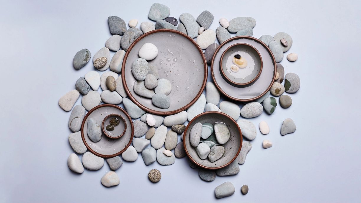 Overhead of soapstone pots with rocks