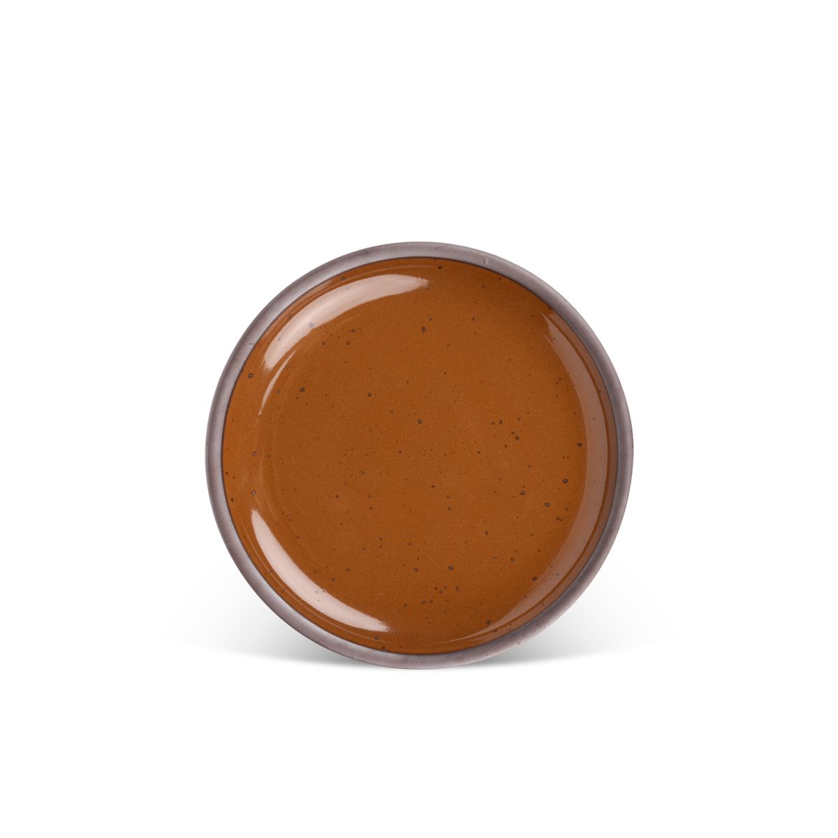 A medium sized ceramic plate in a glossy caramel brown color featuring iron speckles and an unglazed rim.