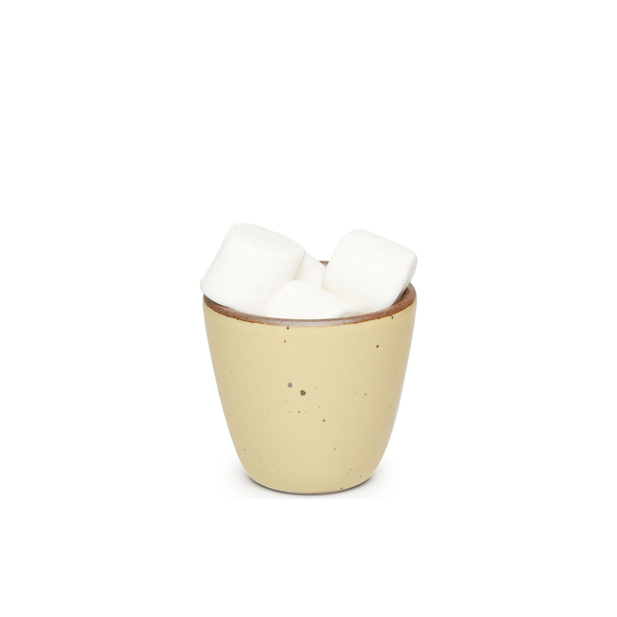 A short cup that tapers out to get wider at the top in a light butter yellow color featuring iron speckles, filled with marshmallows