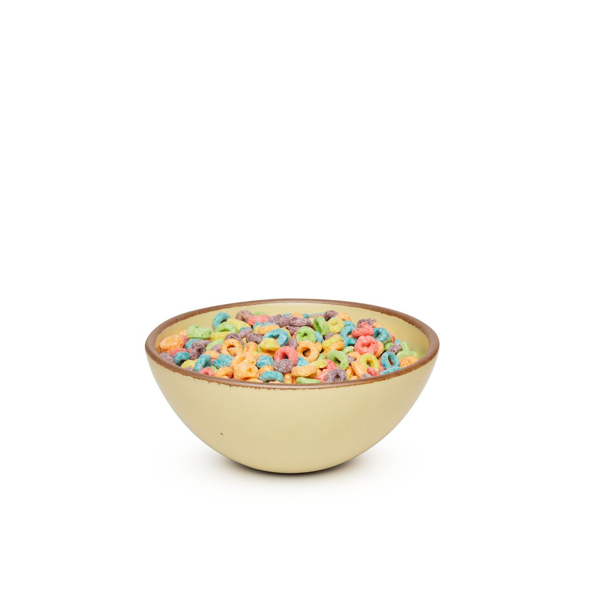 A medium rounded ceramic bowl in a light butter yellow color featuring iron speckles and an unglazed rim, filled with cereal