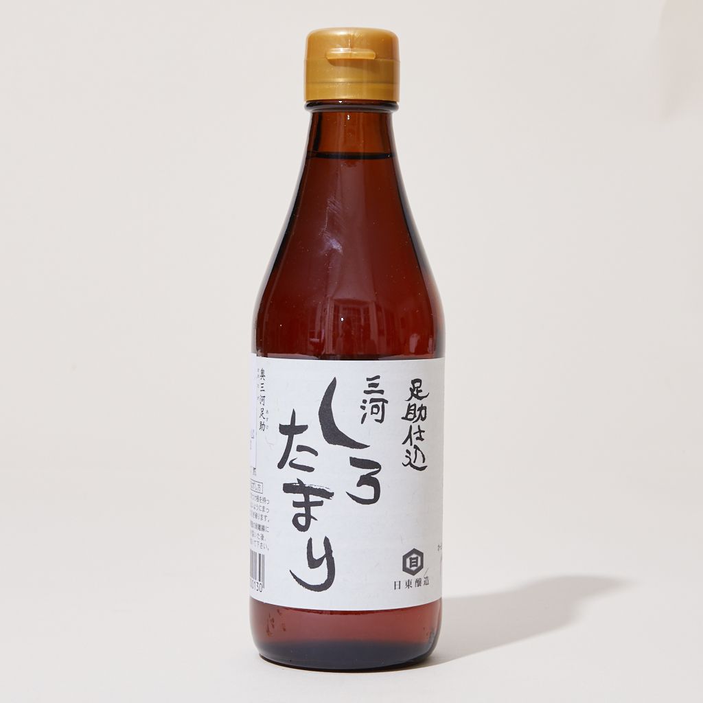 A bottle of white tamari with a gold cap