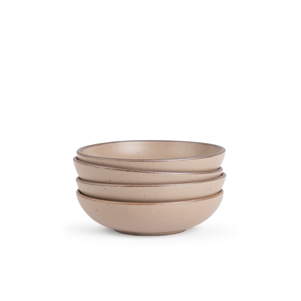 A stack of 4 dinner-sized shallow ceramic bowls in a warm pale brown color featuring iron speckles and an unglazed rim