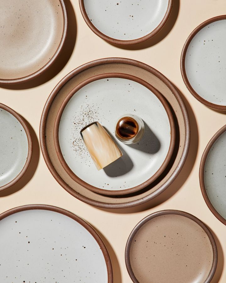 Salt and Pepper Shaker made from organic horn material on table with East Fork plates