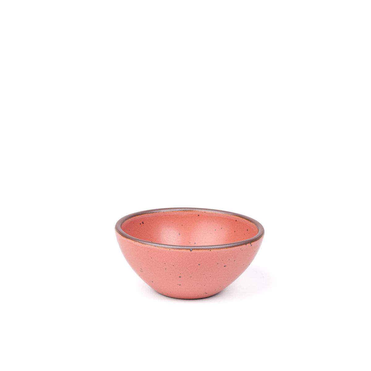 A small dessert sized rounded ceramic bowl in a watermelon pink color featuring iron speckles and an unglazed rim