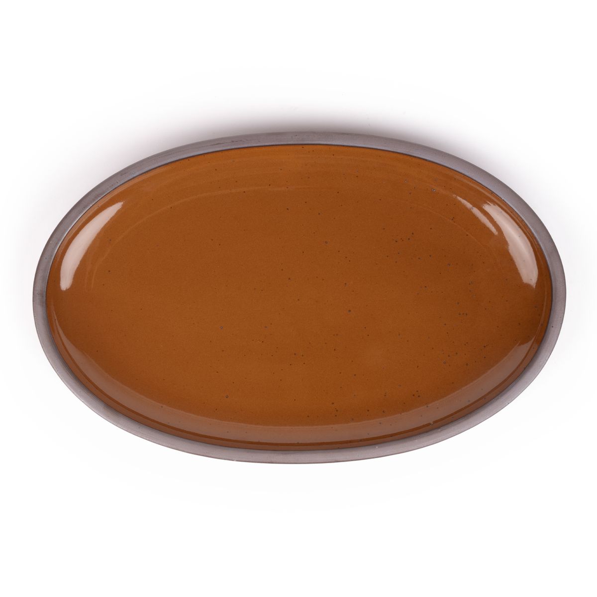 A large oval ceramic platter in a glossy caramel brown color featuring iron speckles and an unglazed rim