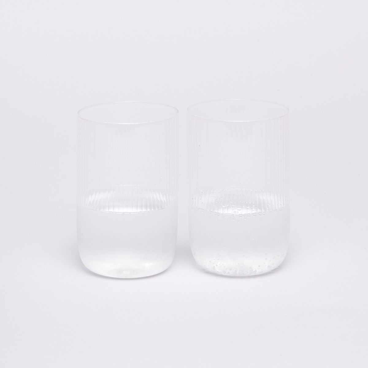 two glasses half full of water