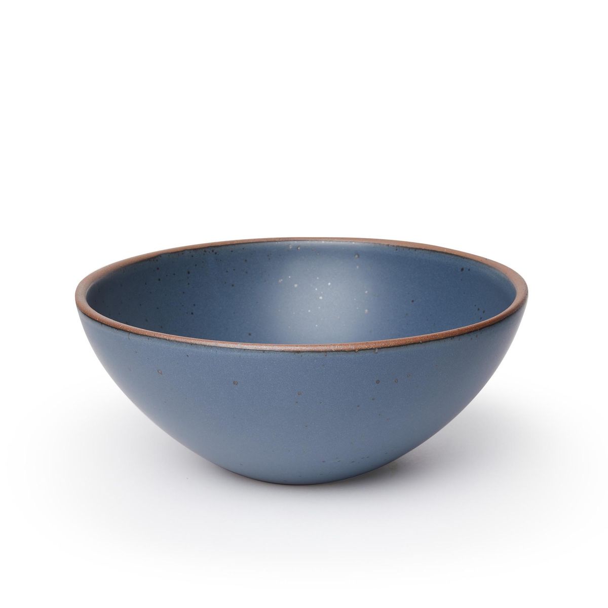 A large ceramic mixing bowl in a toned-down navy color featuring iron speckles and an unglazed rim