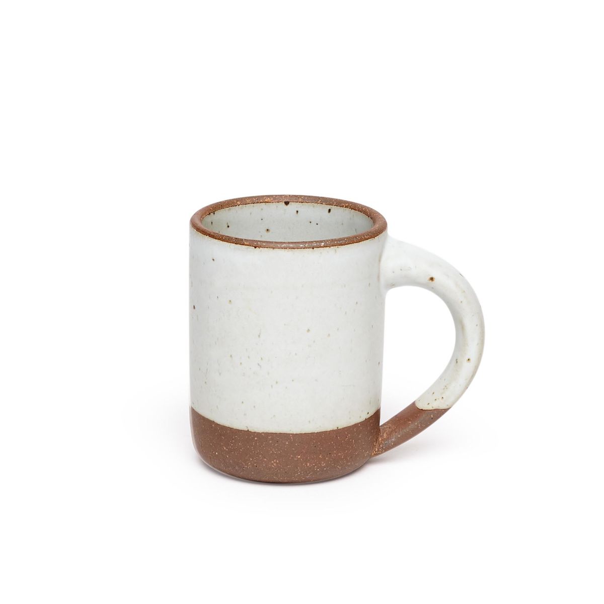 A medium sized ceramic mug with handle in a cool white color featuring iron speckles and unglazed rim and bottom base.