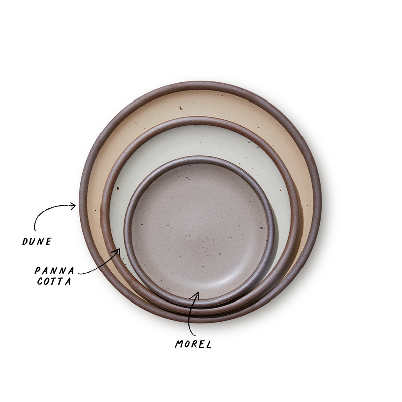 A stack of 3 plates in Dinner, Side, and Cake sizes in a beige, white, and warm pale brown colors.