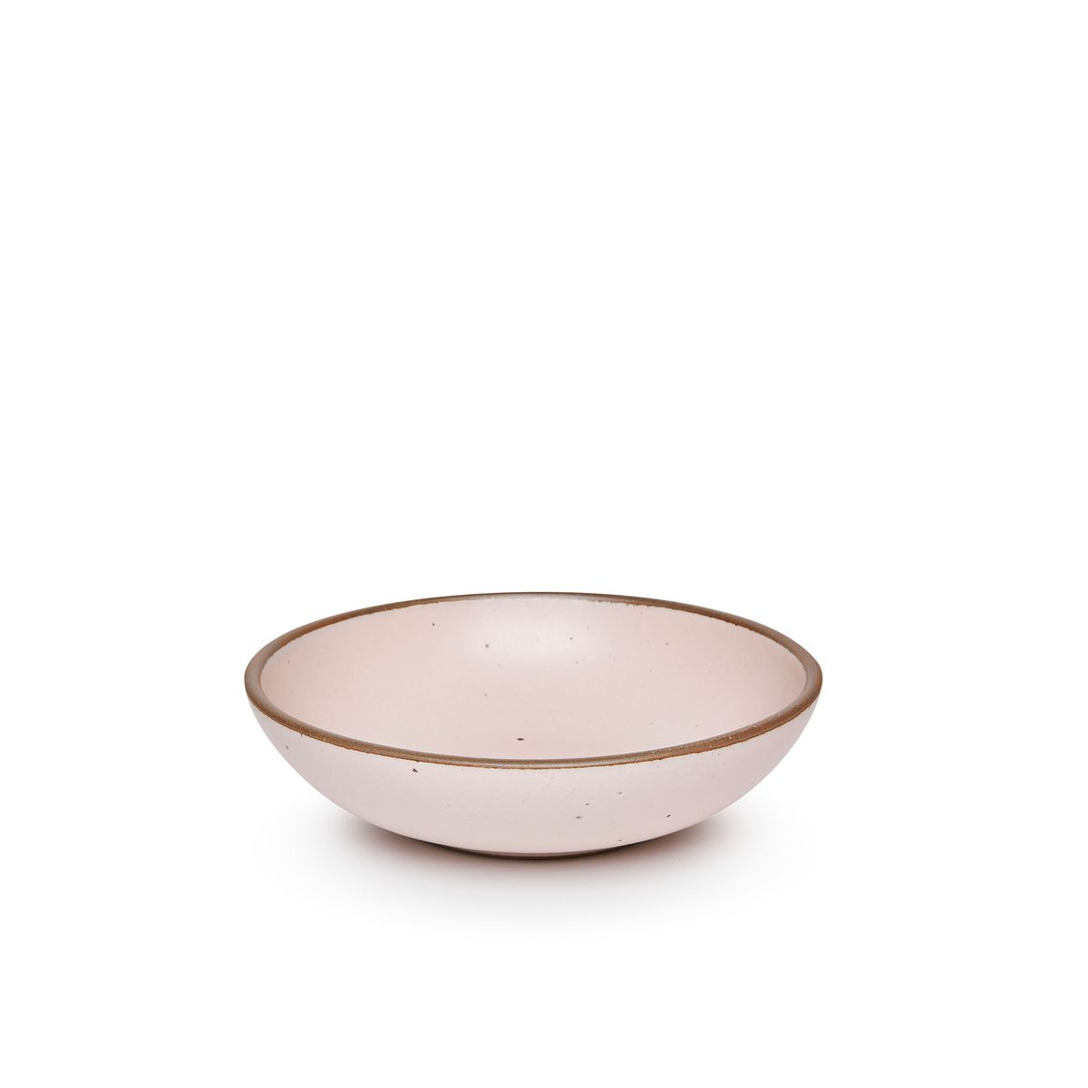 A dinner-sized shallow ceramic bowl in a soft light pink color featuring iron speckles and an unglazed rim