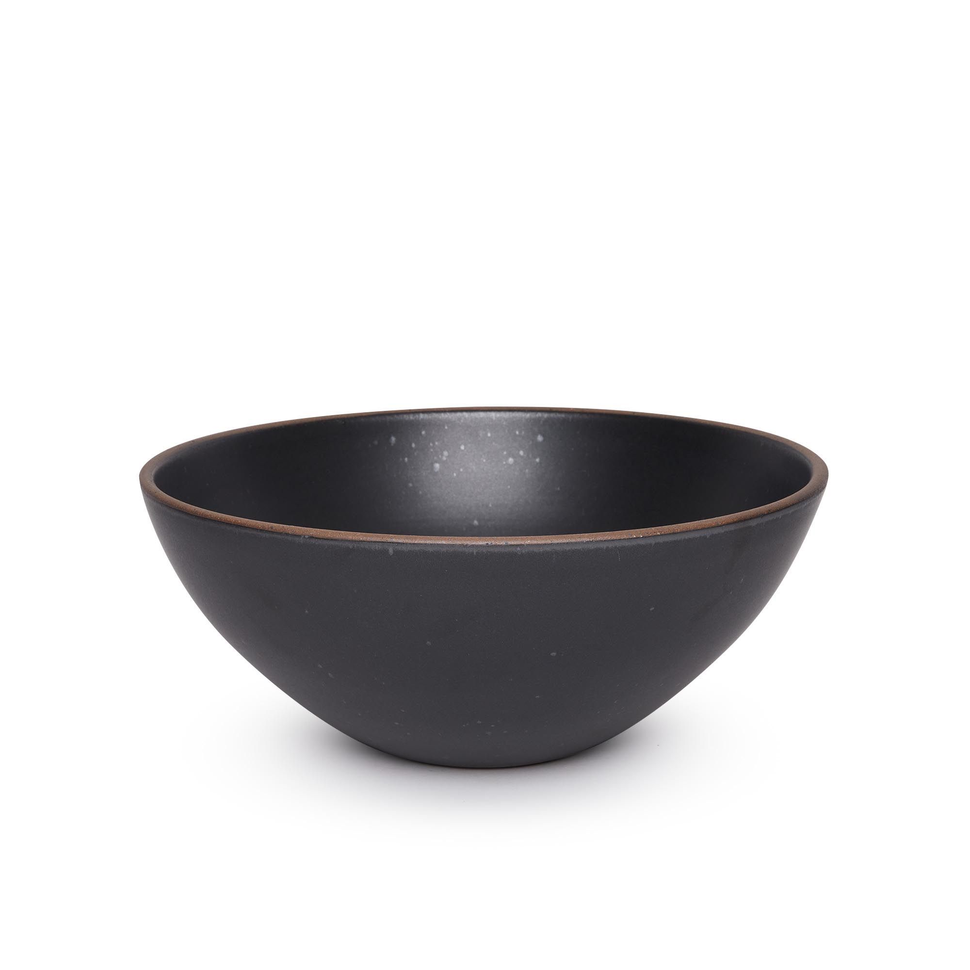 A large ceramic mixing bowl in a graphite black color featuring iron speckles and an unglazed rim