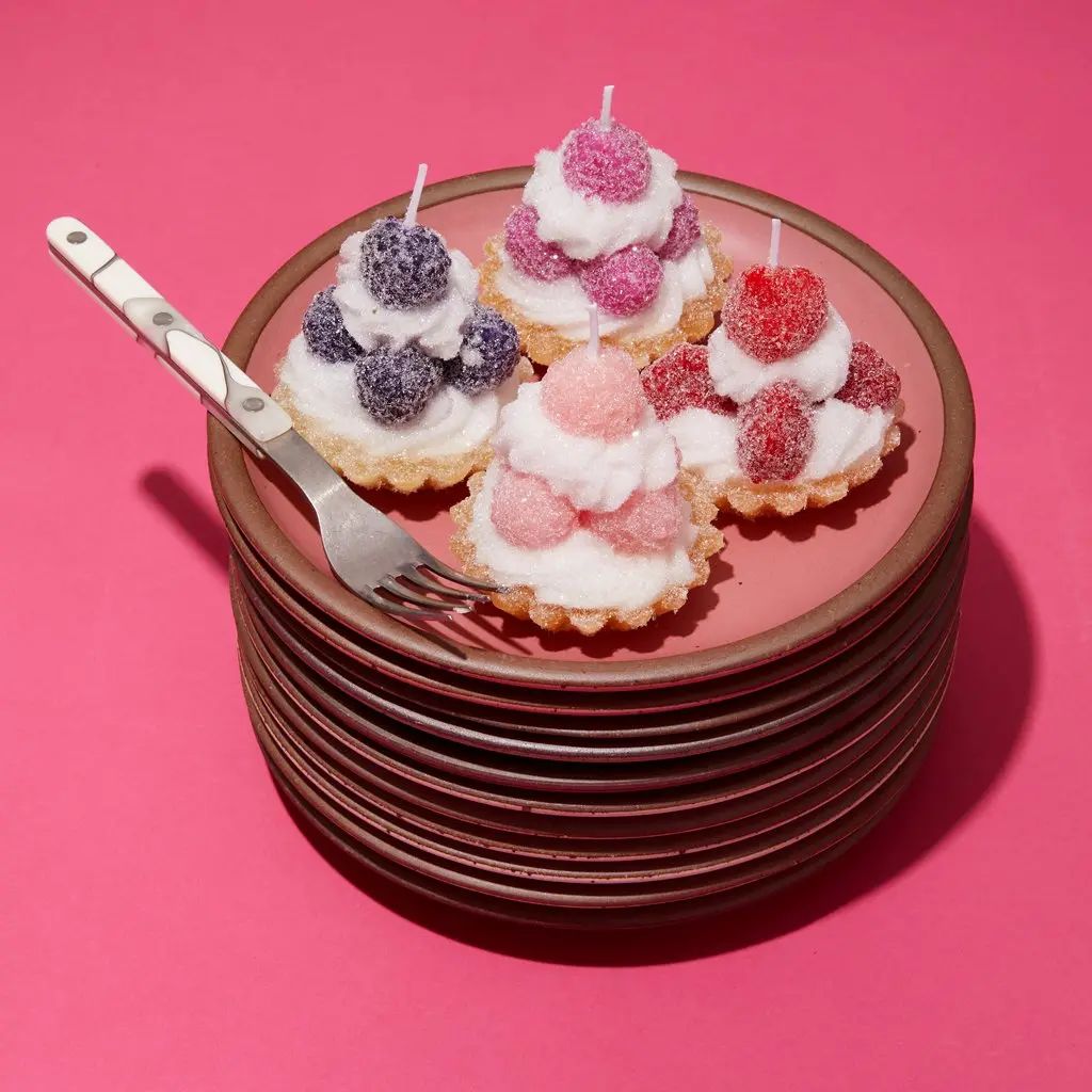 Candles that are not baked goods but have been designed to resemble them in color, size, shape and texture