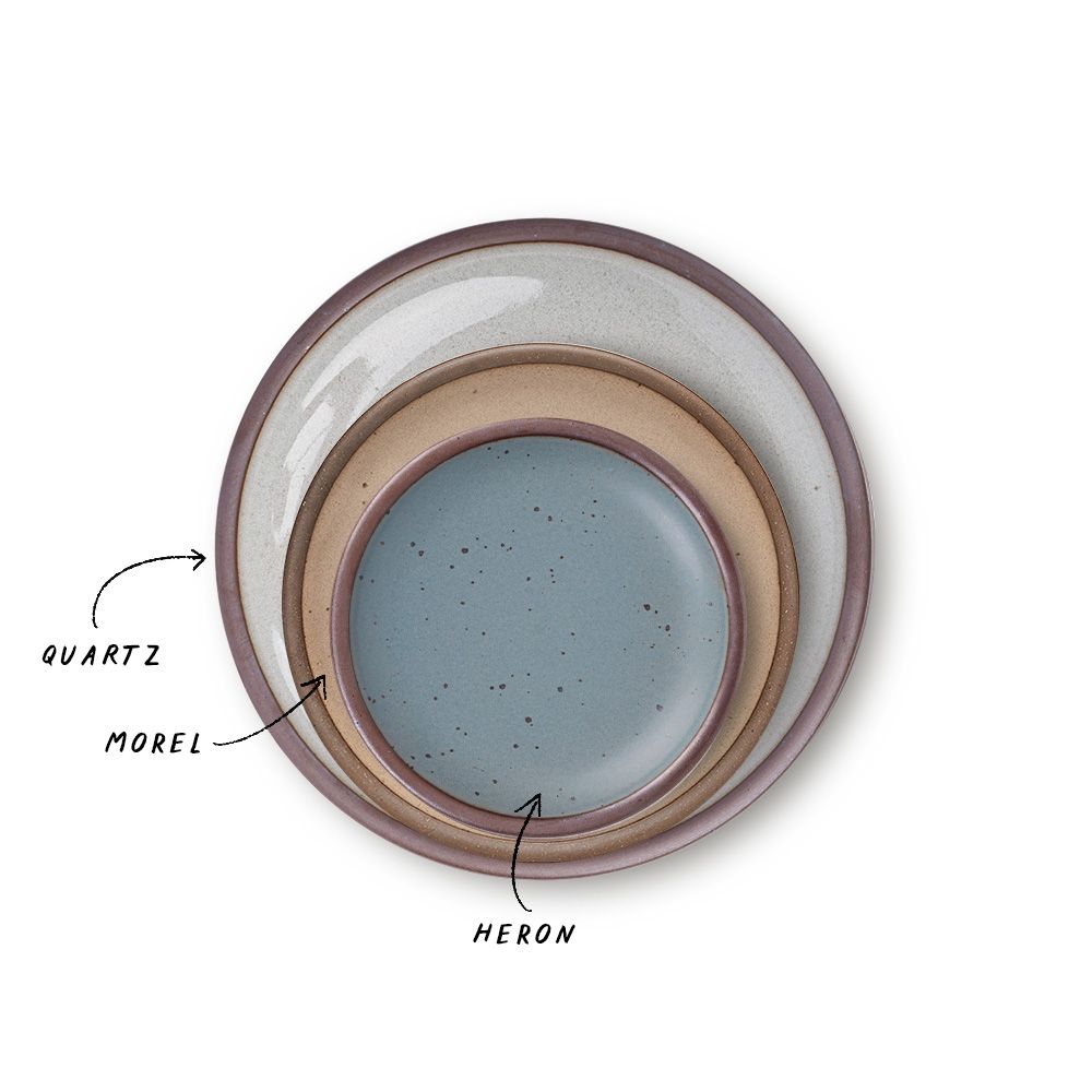 A stack of 3 plates in Dinner, Side, and Cake sizes in a reflective icy white, warm pale brown, and blue-grey colors.