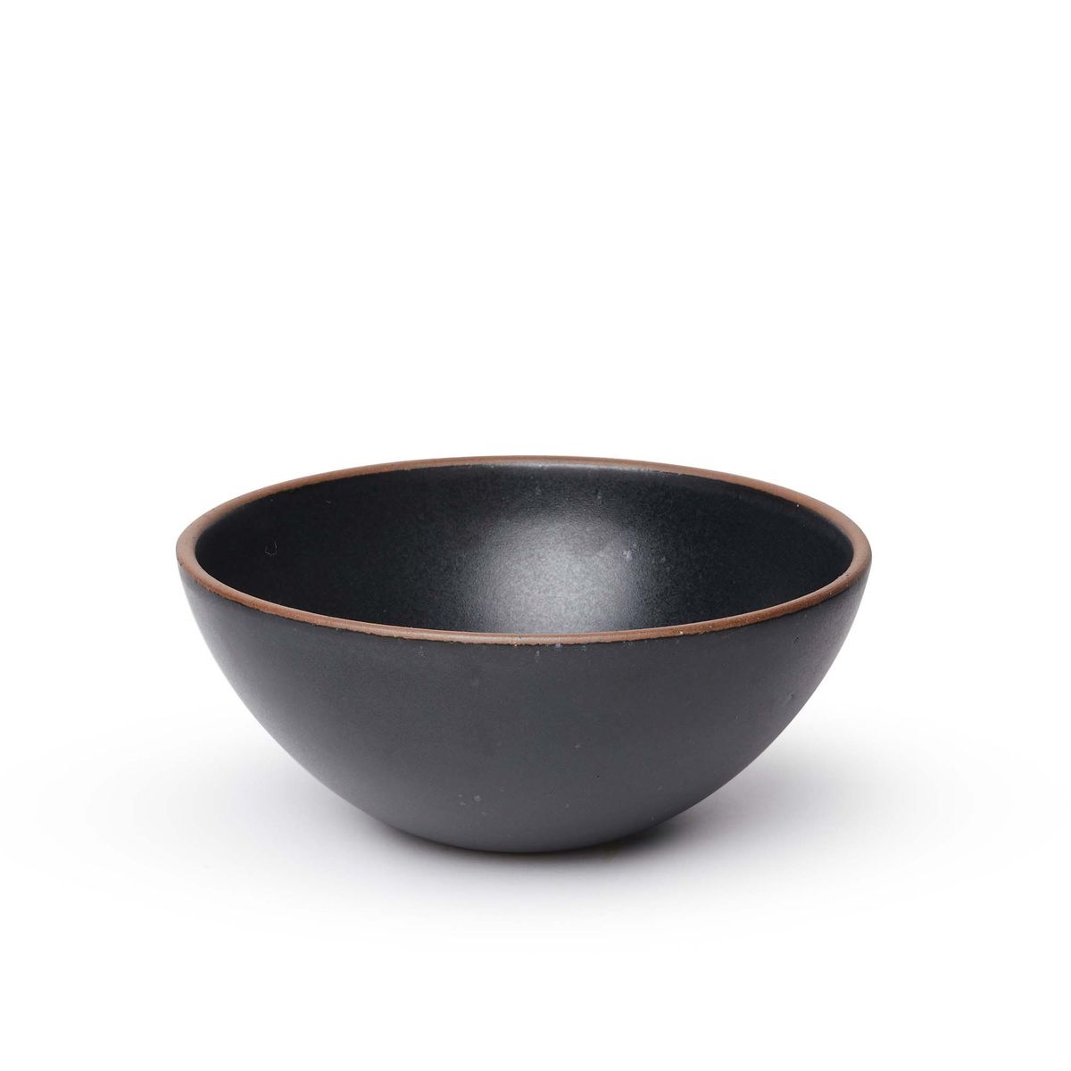 A large rounded ceramic bowl in a graphite black color featuring iron speckles and an unglazed rim