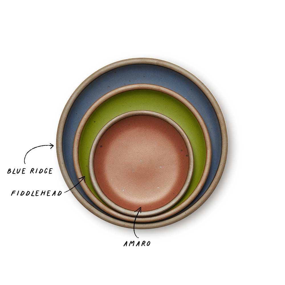 A stack of 3 plates in Dinner, Side, and Cake sizes in a cool, medium blue, fern green, and cool terracotta colors.