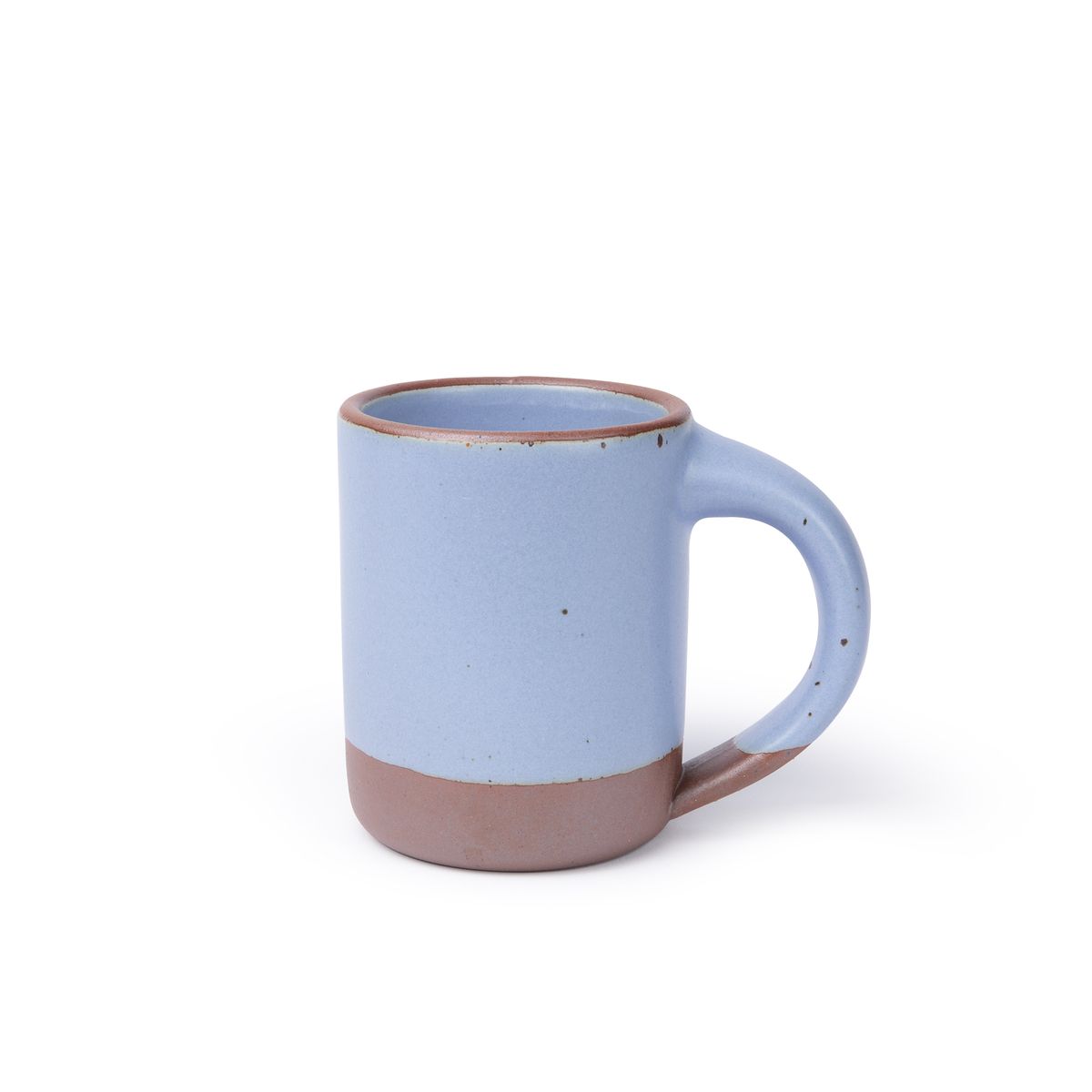 A medium sized ceramic mug with handle in a periwinkle color featuring iron speckles and unglazed rim.