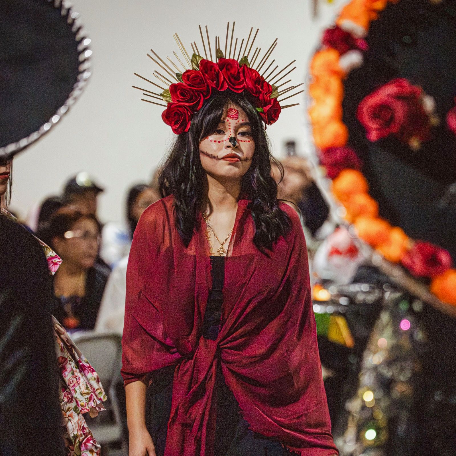 4 ceramic dinner plates, 4 side plates, and 4 shallow dinner bowls in a cool white color with iron speckles and unglazed rims are stacked all together on a table with oranges.