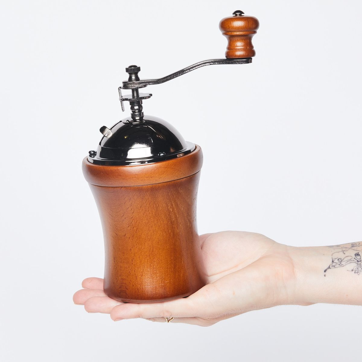 hand holding coffee grinder