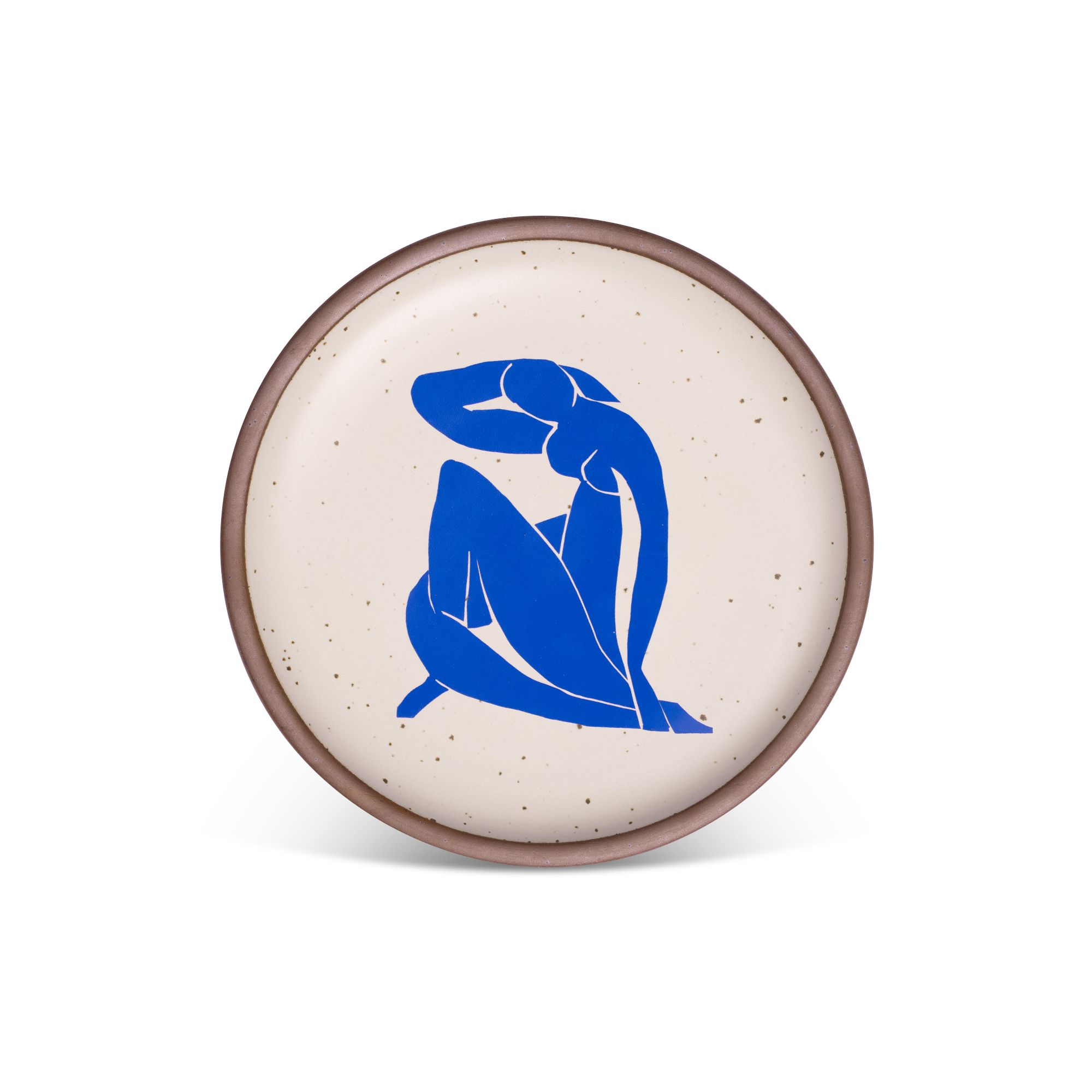 A bright blue, abstract, silhouetted female figure in a curled, seated position, with sharp cut-out edges, centered on an off-white ceramic plate with an unglazed rim.