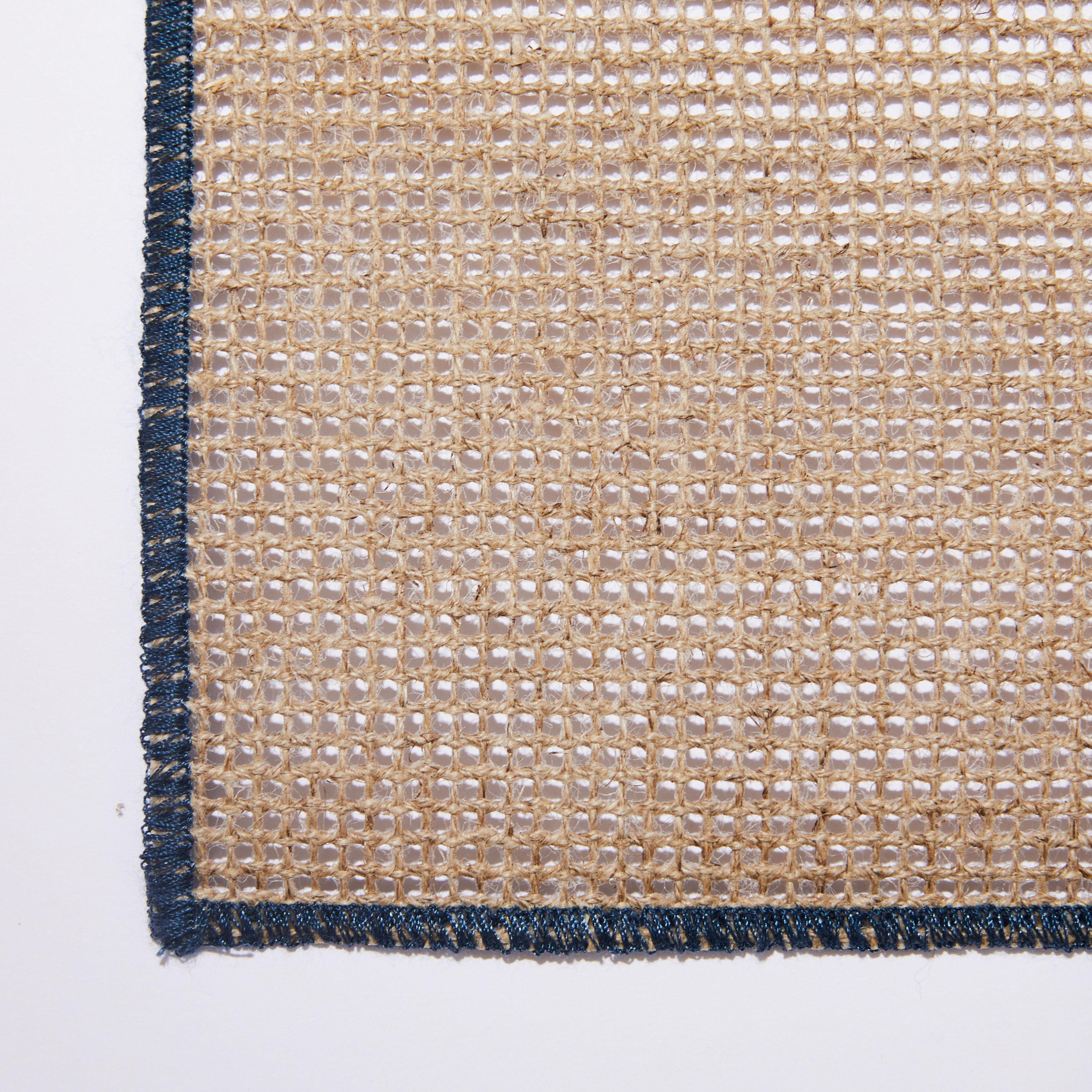 Close up Quadrille Placemat with dark blue border