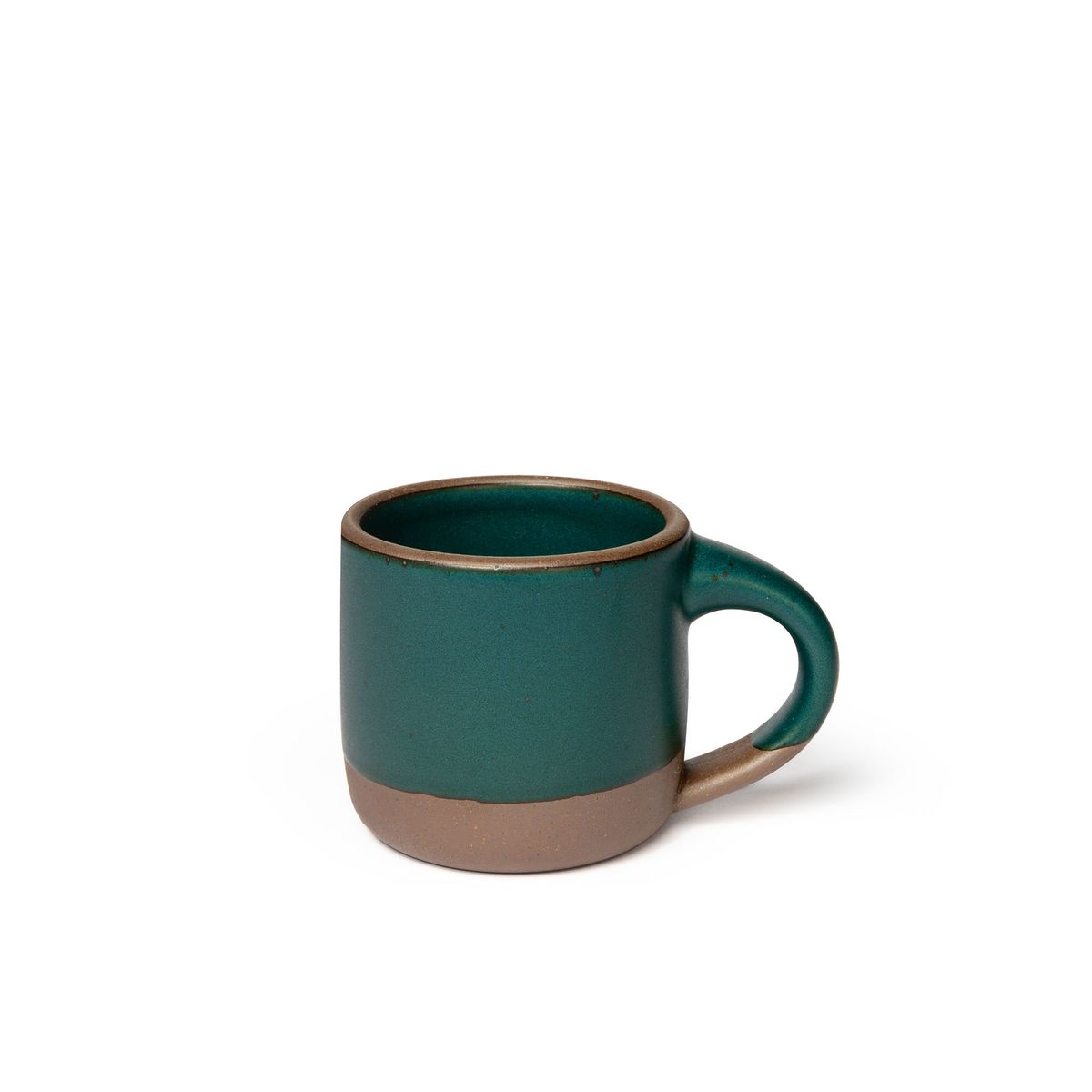 A small sized ceramic mug with handle in a deep dark teal glaze featuring iron speckles and unglazed rim and bottom base.
