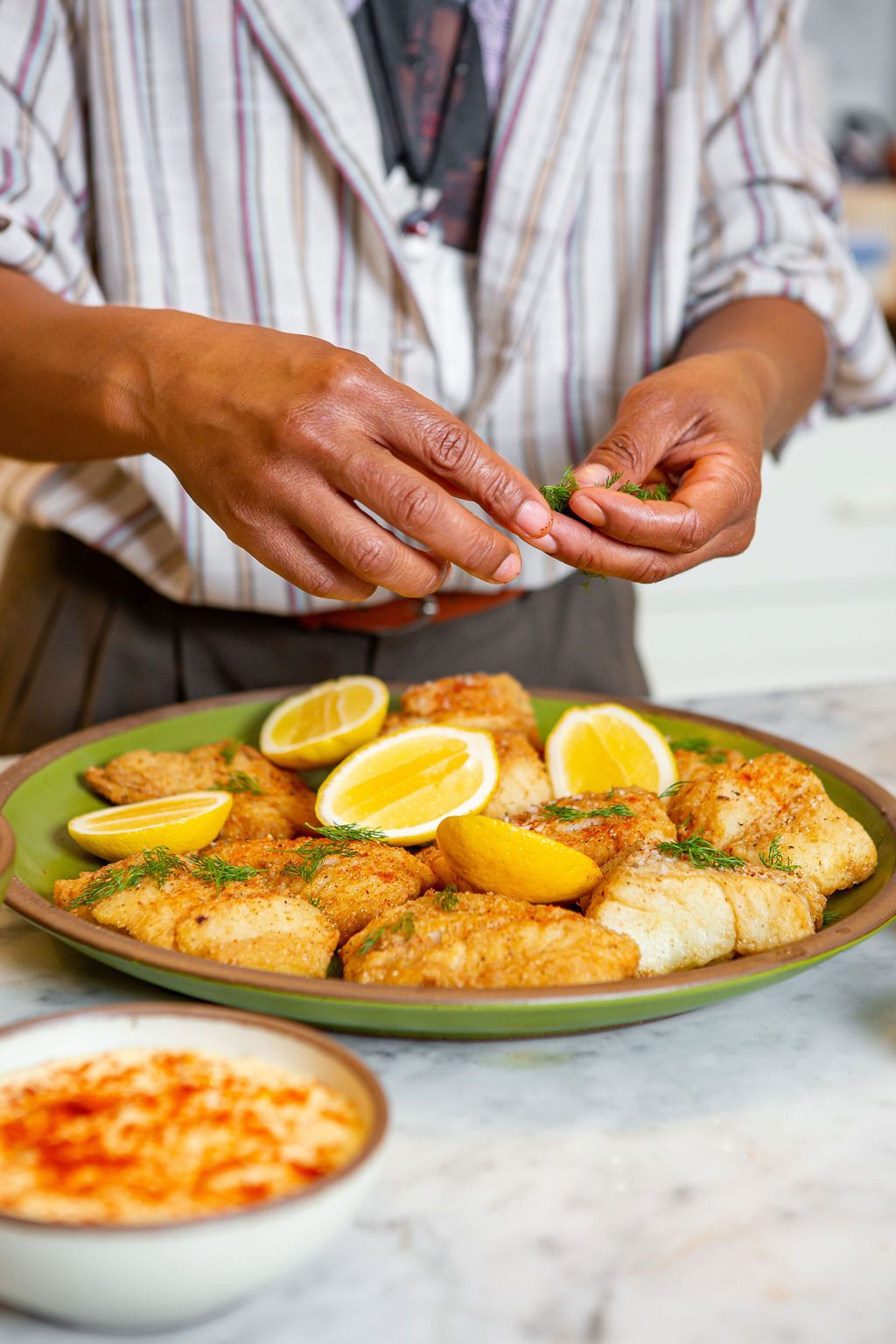 Cod and lemons on East Fork fiddlehead plate