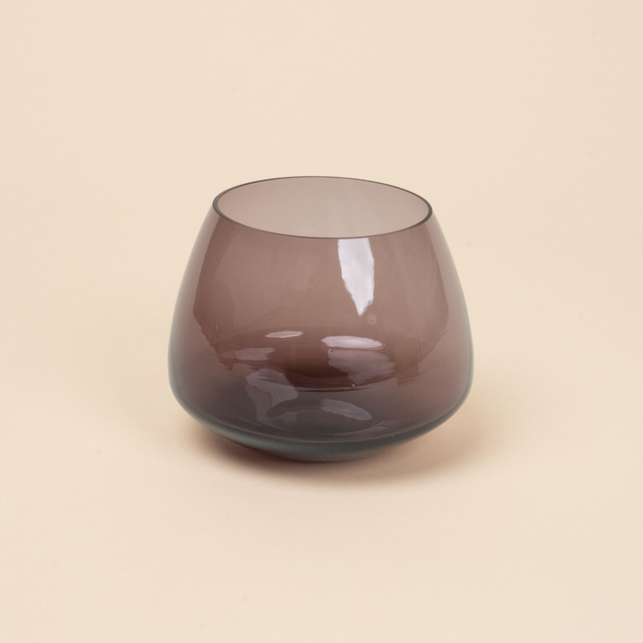 Muted purple glass whiskey snifter with a rounded base