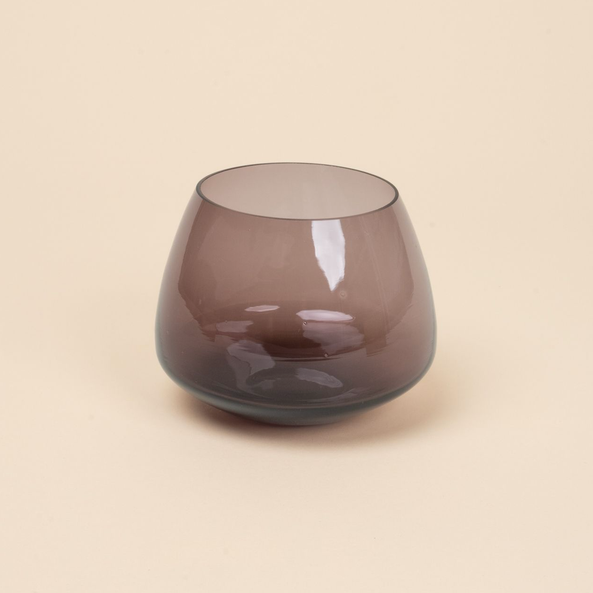 Muted purple glass whiskey snifter with a rounded base