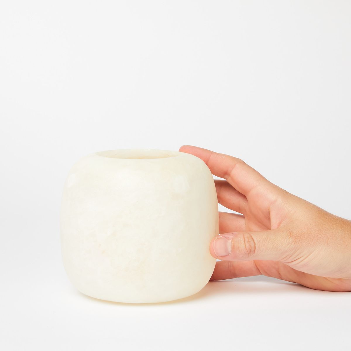 Hand Holding Small Alabaster Candle Holder