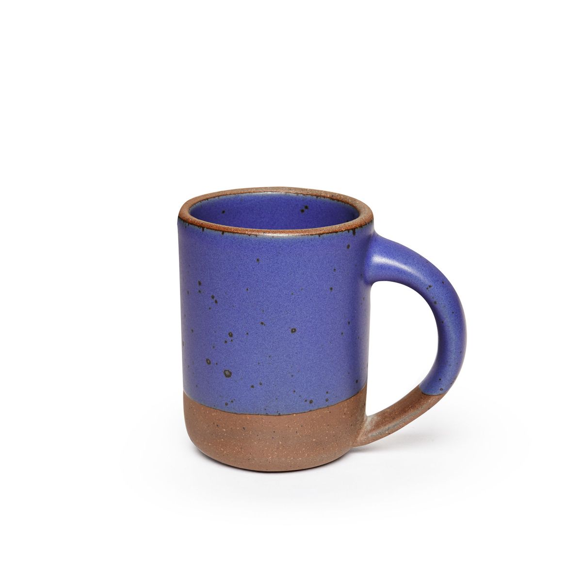 A medium sized ceramic mug with handle in a true cool blue color featuring iron speckles and unglazed rim and bottom base.