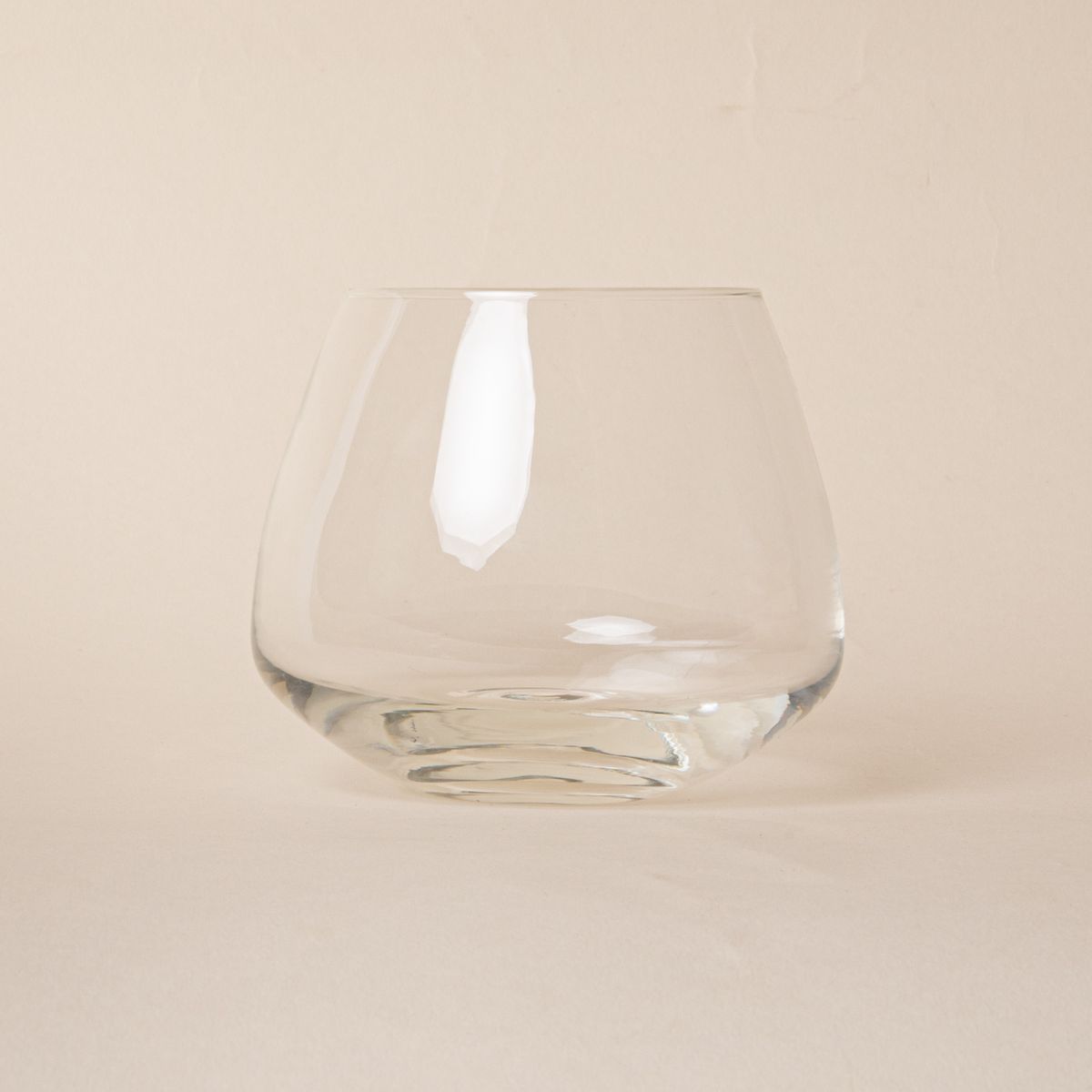 Clear glass whiskey snifter with a rounded base