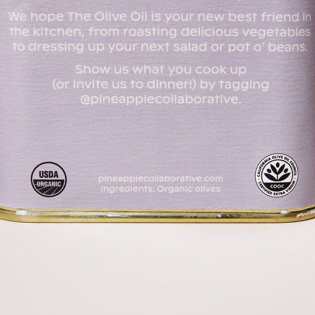 Close-up of sentences on the back of a can of olive oil