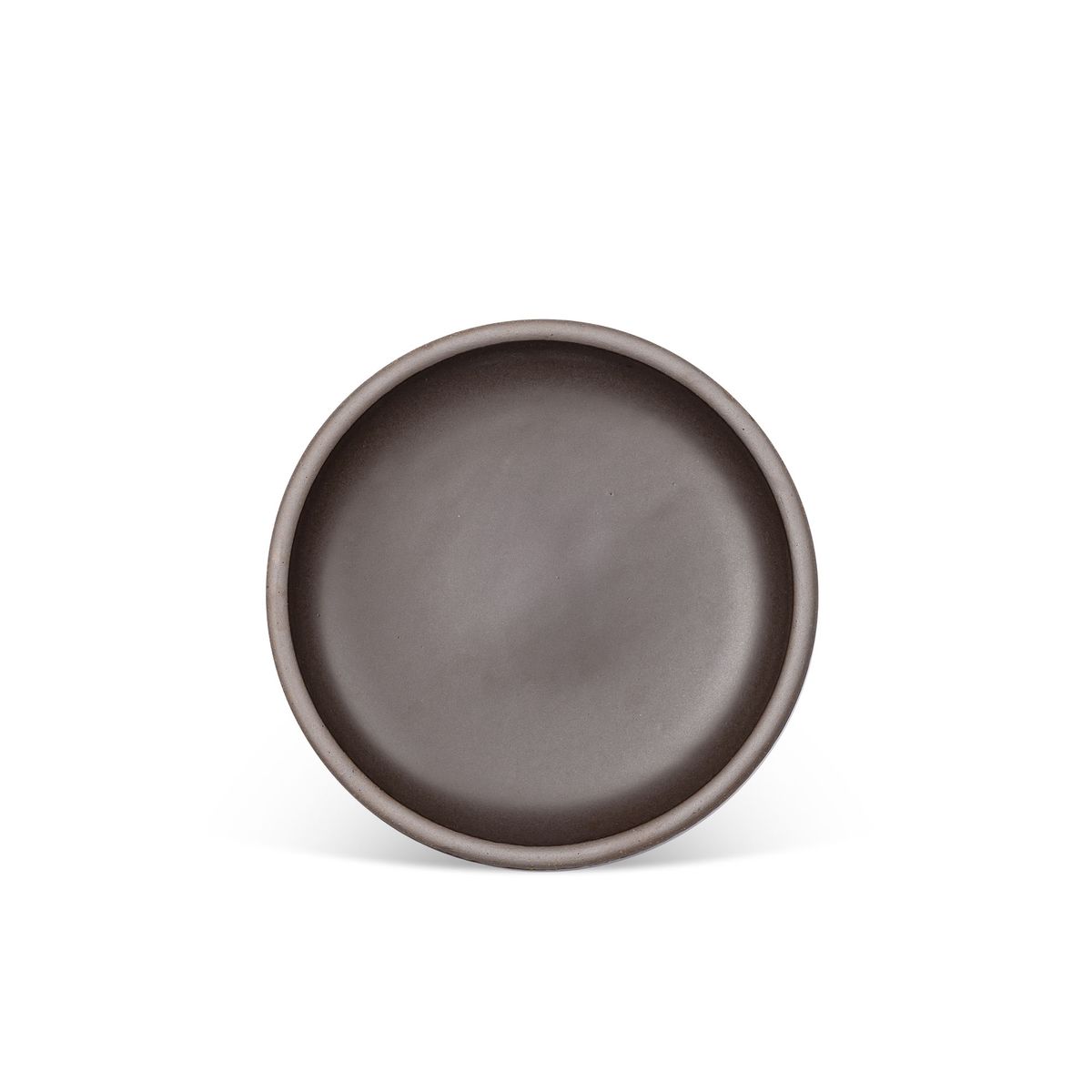 A medium sized ceramic plate in a dark cool brown color featuring iron speckles and an unglazed rim.