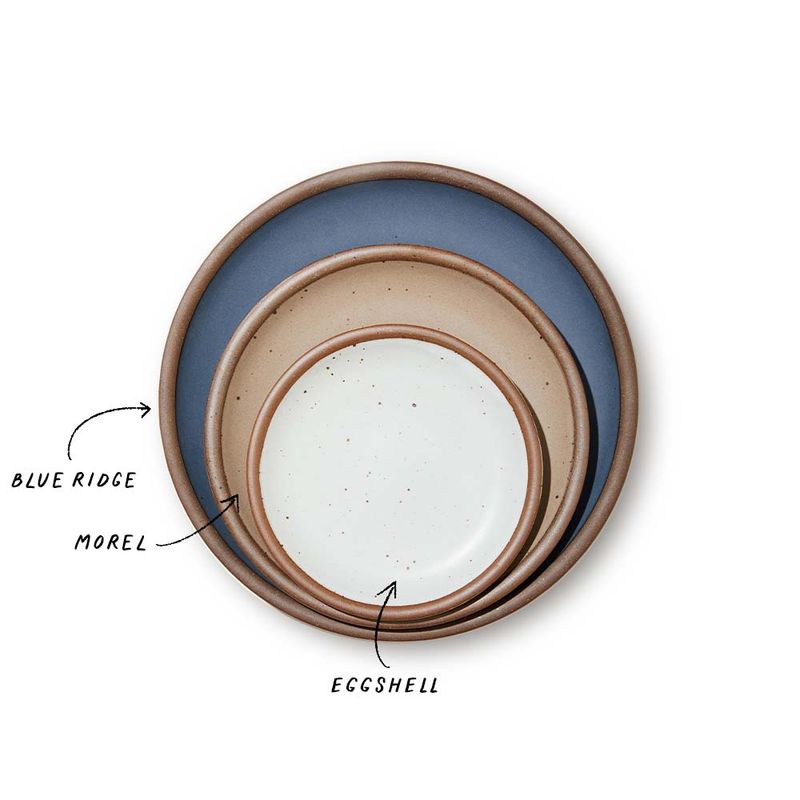 A stack of 3 plates in Dinner, Side, and Cake sizes in a cool medium blue, warm pale brown, and white colors.
