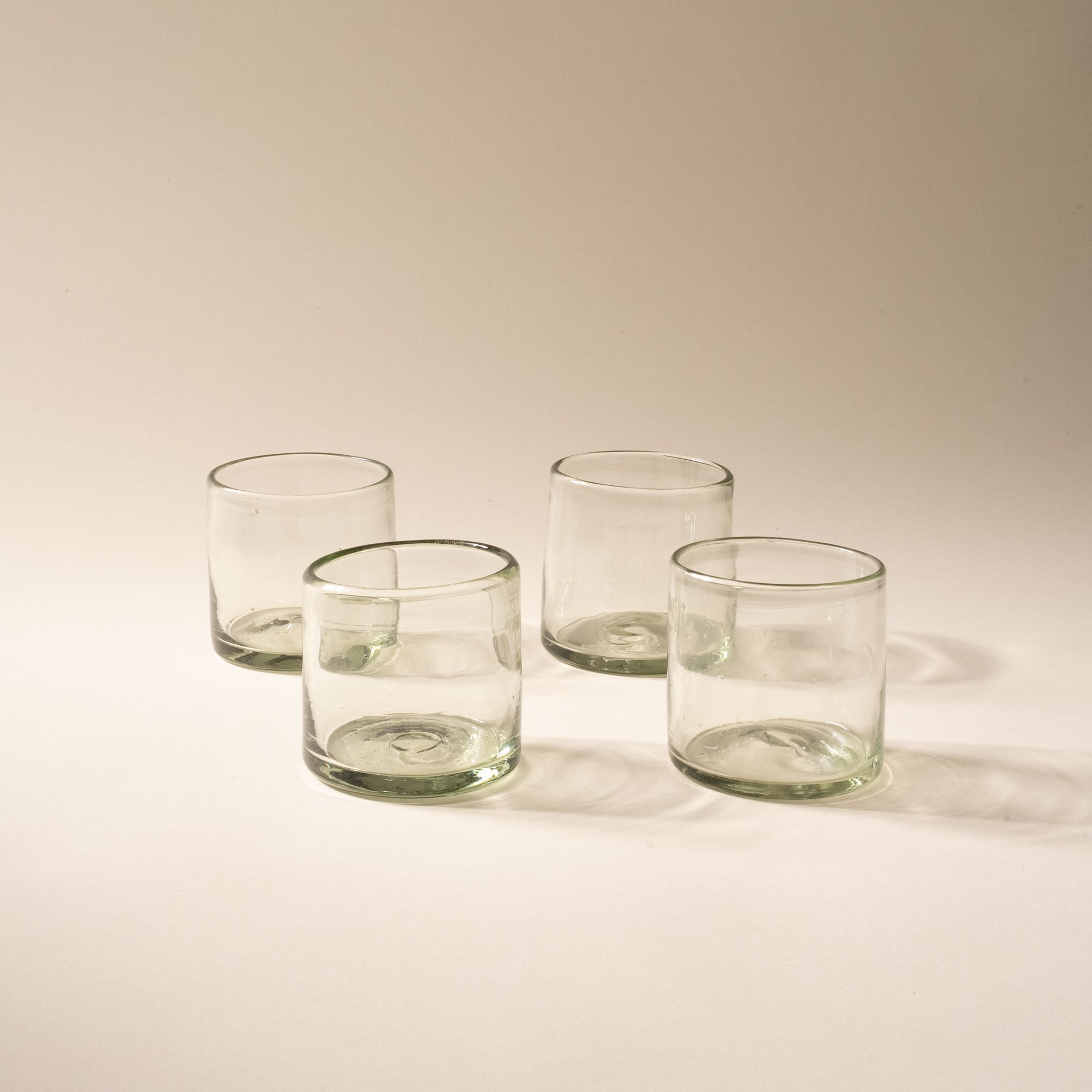 4 short clear drinking glasses