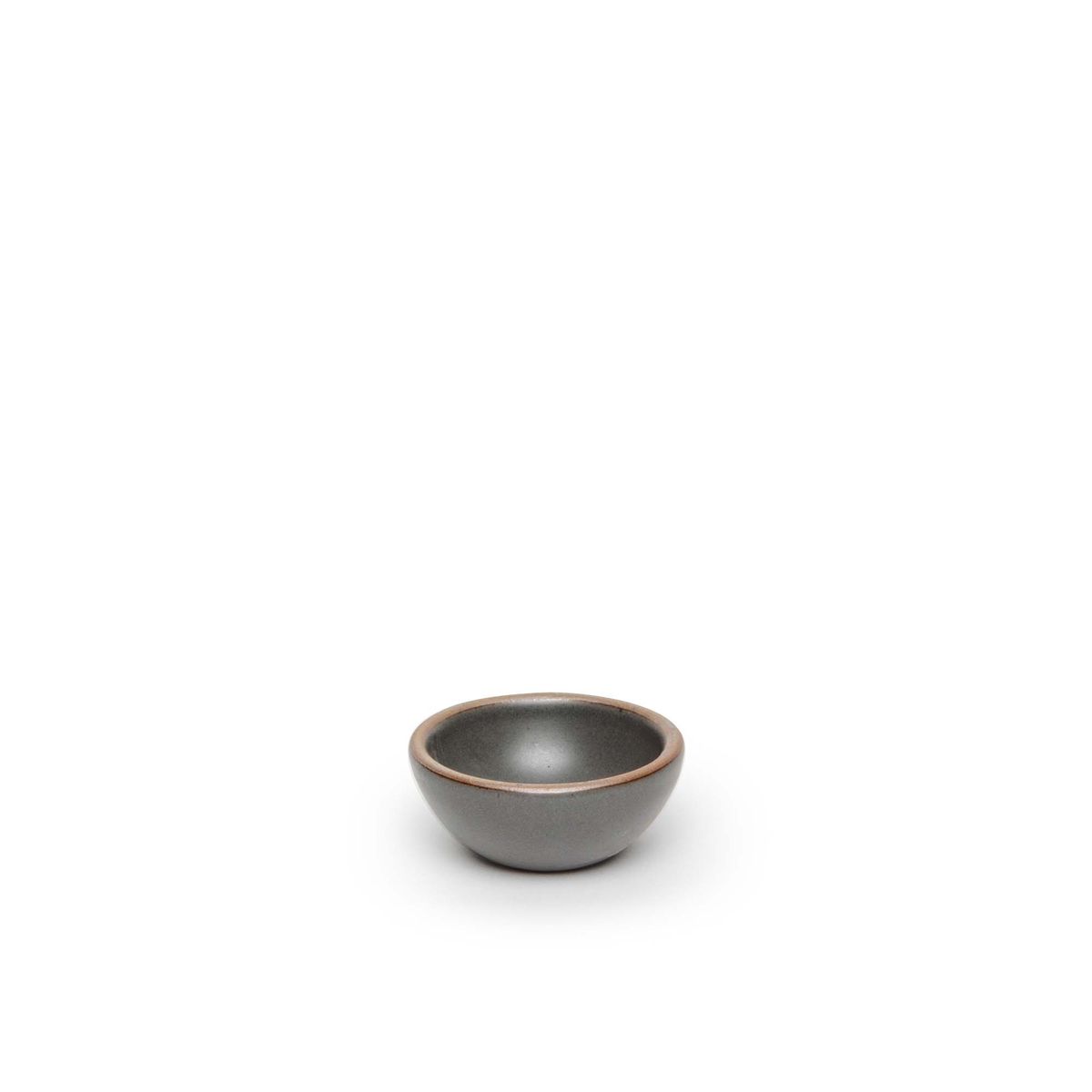 A tiny rounded ceramic bowl in a cool, medium grey color featuring iron speckles and an unglazed rim