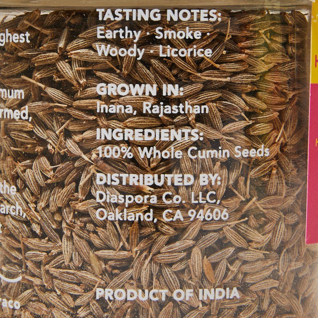 Tasting notes, place of origin and ingredients on the back of glass jar of cumin