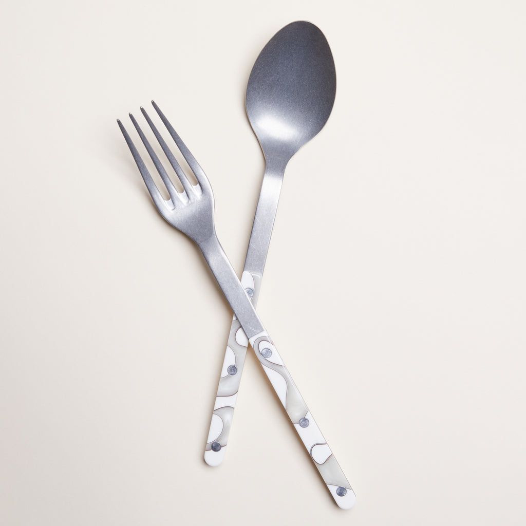 Stainless steel spoon and fork with elongated handles for serving. Handles are coated with acrylic ivory pattern.