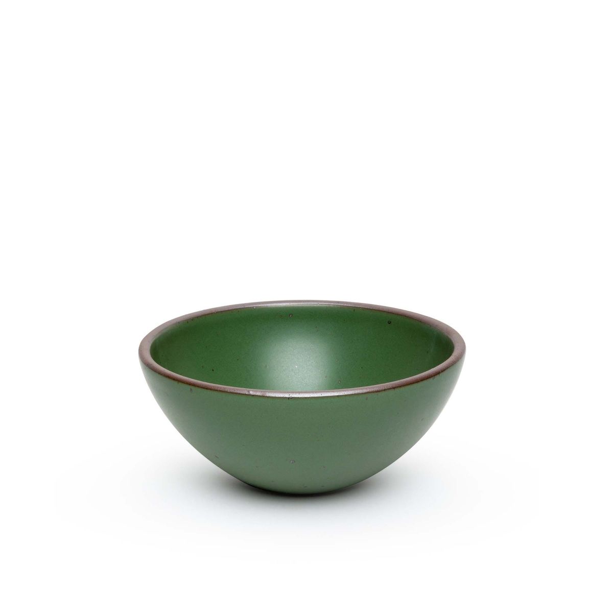 A medium rounded ceramic bowl in a deep, verdant green color featuring iron speckles and an unglazed rim