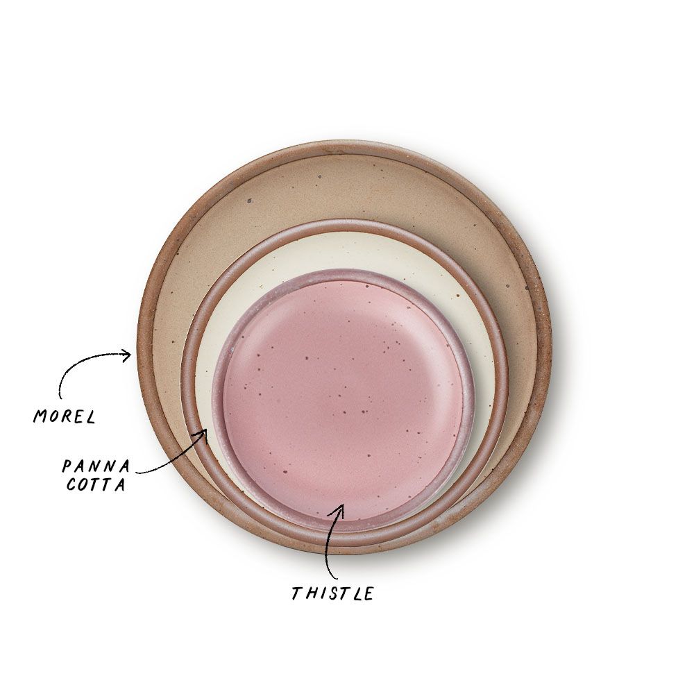 A stack of 3 plates in Dinner, Side, and Cake sizes in a dusty mauve pink, warm pale brown, and warm off-white colors.