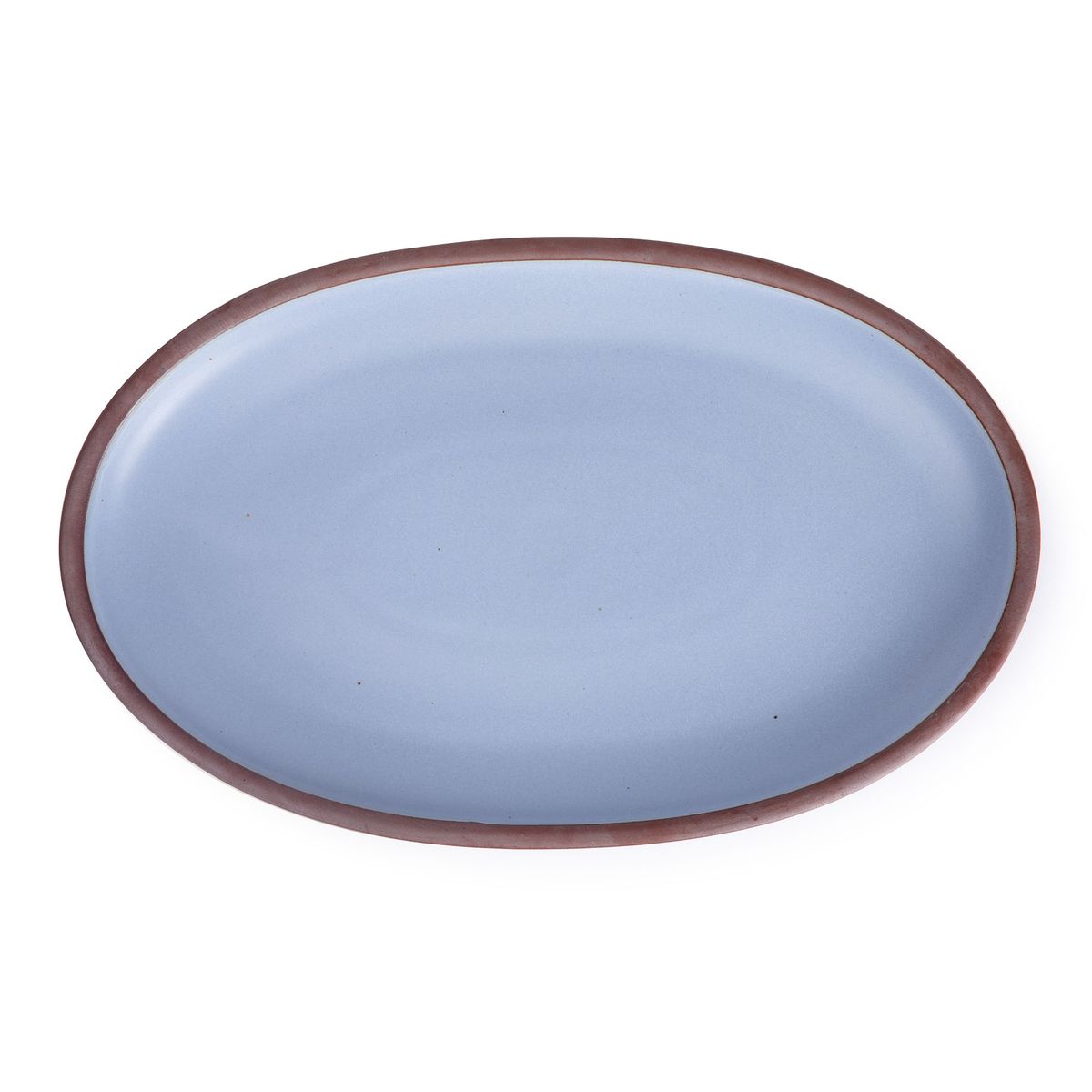 A large oval ceramic platter in a periwinkle color featuring iron speckles and an unglazed rim