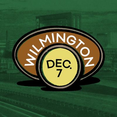 A crayon drawing of a brown Oval Platter and a yellow Cake Plate with words that read 'Wilmington Dec. 7' against a photo of Downtown Wilmington with a green filter over it.