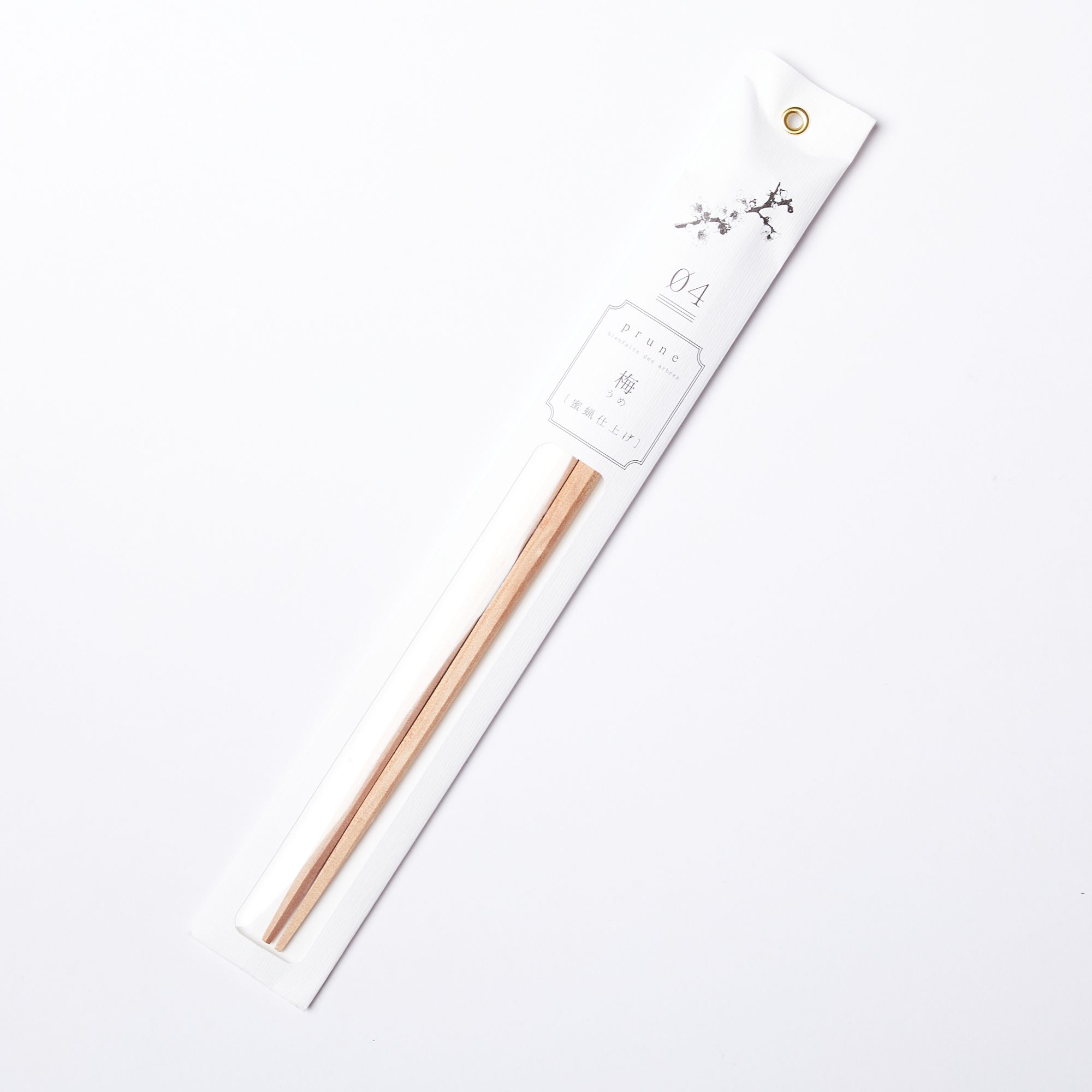 Simple pair of light wood chopsticks packaged in thin paper packaging