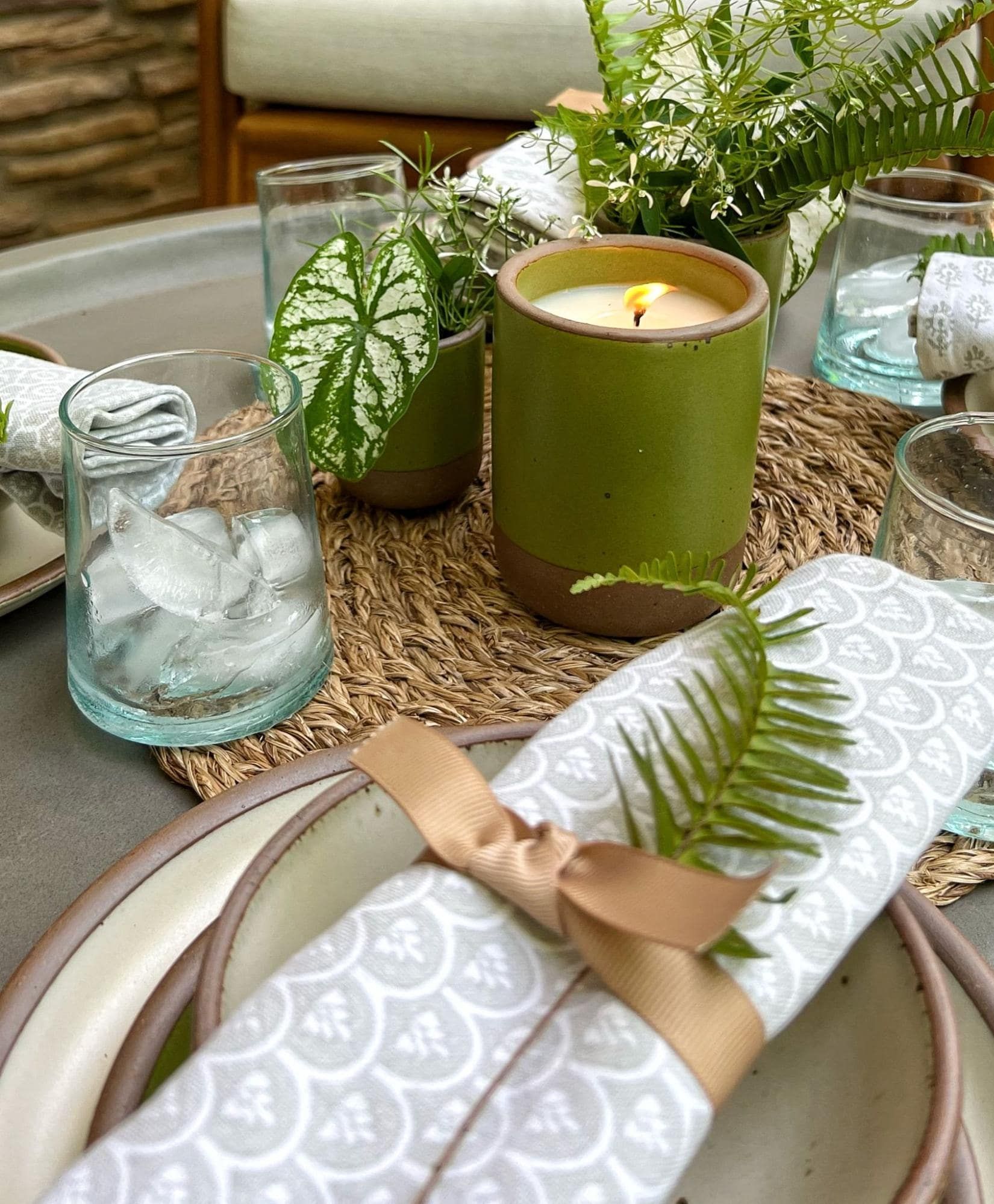 Fiddlehead candle and napkin with fern