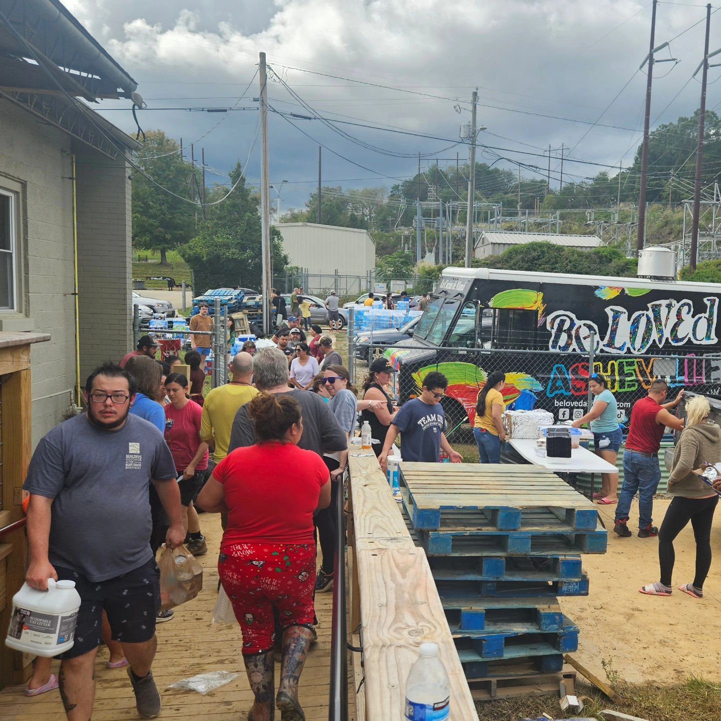 Outside is the BeLoved Asheville truck with people all over helping to share supplies in the Hurricane Helene relief.