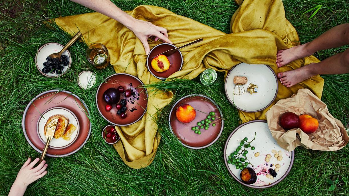 Amaro and Panna Cotta Pottery in grass with fruit